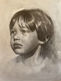 a charcoal drawing of a young boy